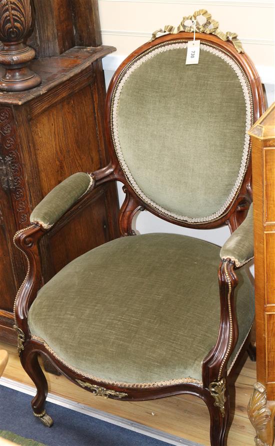 A pair of Victorian rosewood armchairs, W.2ft 1in. D.2ft 4in. H.3ft 4in.